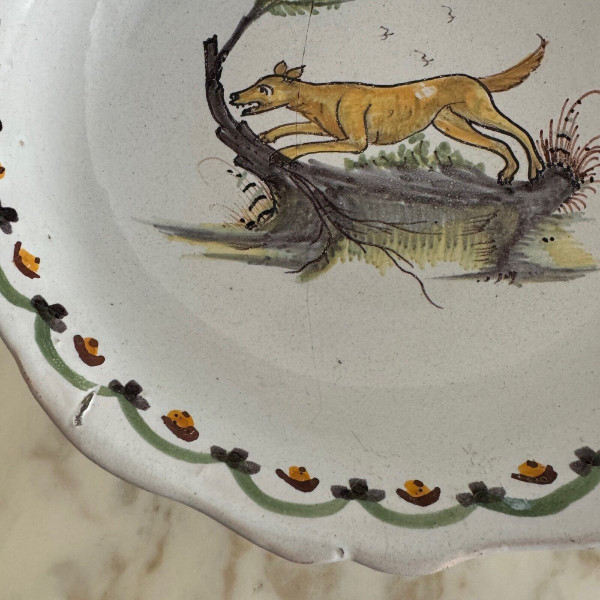 18th century Nevers earthenware salad bowl with gadrooned dog decoration