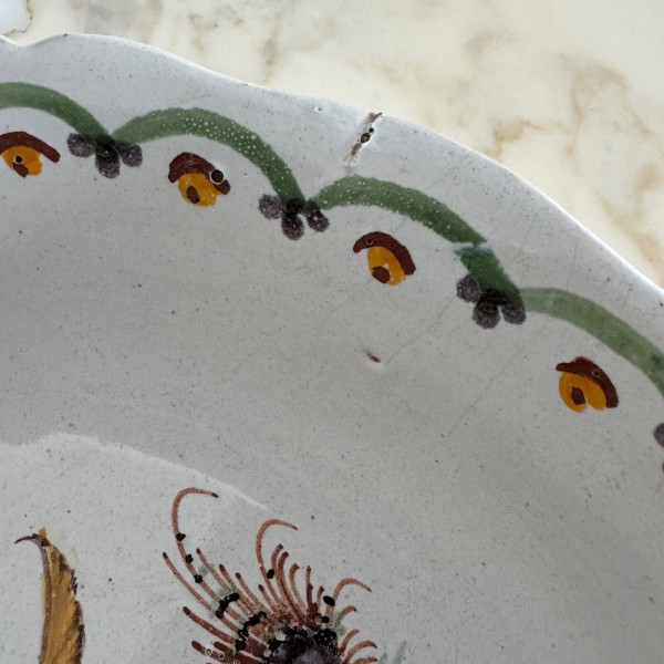18th century Nevers earthenware salad bowl with gadrooned dog decoration