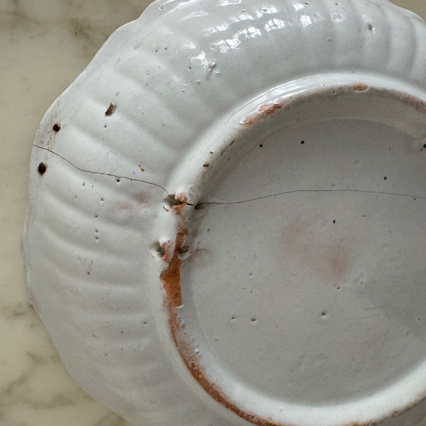 18th century Nevers earthenware salad bowl with gadrooned dog decoration