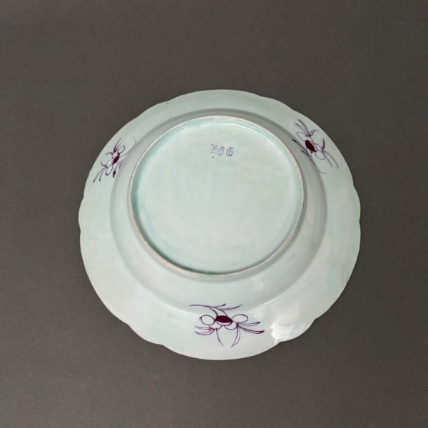 China plate with 19th century signature decorated with butterflies and vegetation