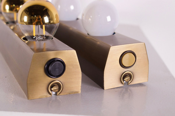 “Vanity lamp” dressing room wall lights, bronze finish.