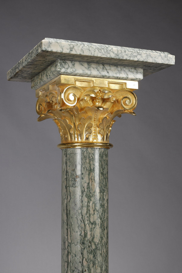 Pair of green Estours marble columns with Corinthian capitals
