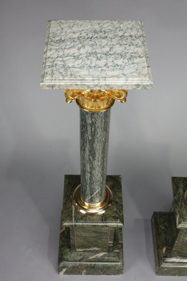 Pair of green Estours marble columns with Corinthian capitals