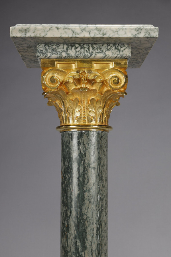 Pair of green Estours marble columns with Corinthian capitals