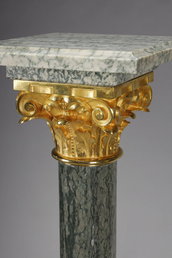 Pair of green Estours marble columns with Corinthian capitals
