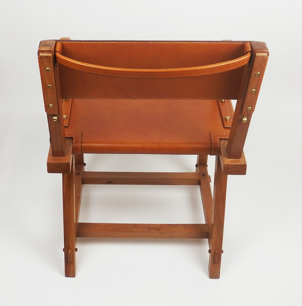 Poltrona in pelle di Jacques Adnet