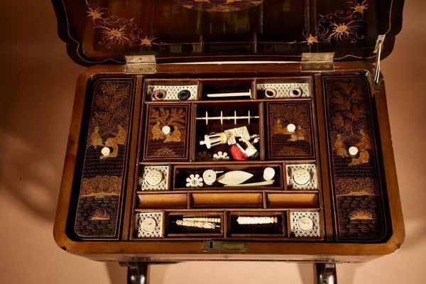 An original lacquered sewing/working table, still with the original Chinese gold paint.