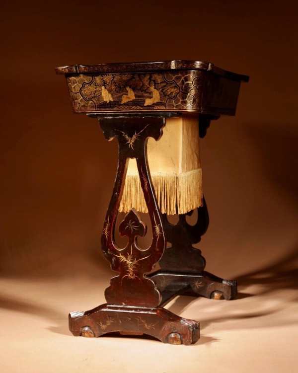 An original lacquered sewing/working table, still with the original Chinese gold paint.
