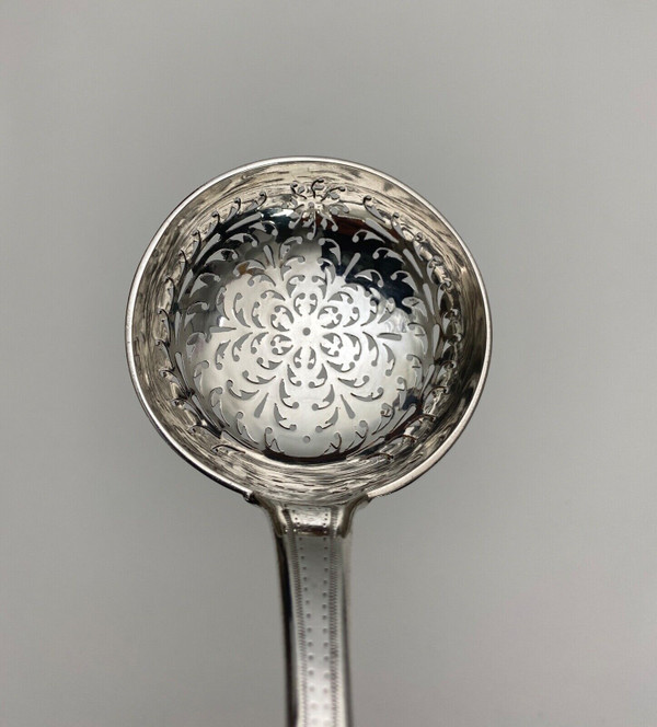 18th century silver sprinkling spoon from the Farmers General