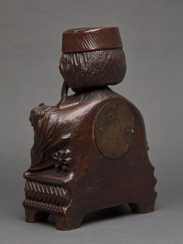 Richly ornamented carved wooden clock 19th century Chinese sage