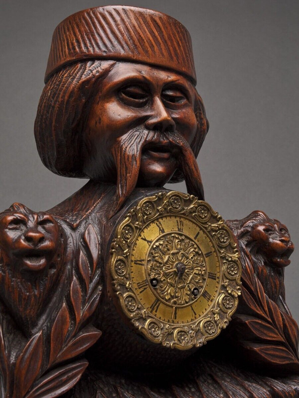Richly ornamented carved wooden clock 19th century Chinese sage