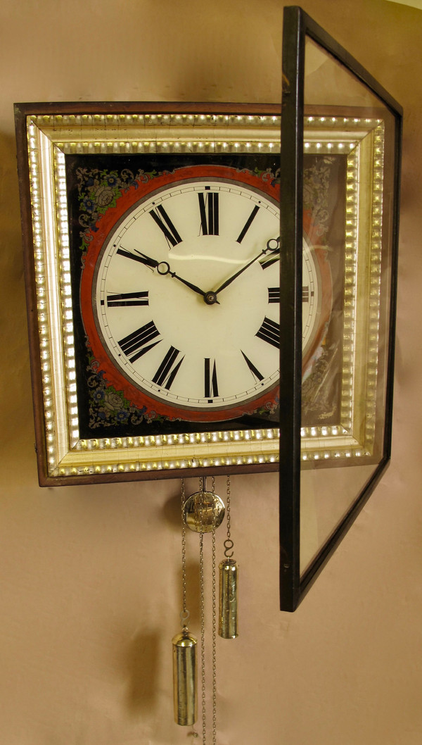 A highly decorative original reverse painted glass (Verre Eglomise) dial wall clock from the