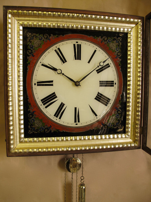A highly decorative original reverse painted glass (Verre Eglomise) dial wall clock from the