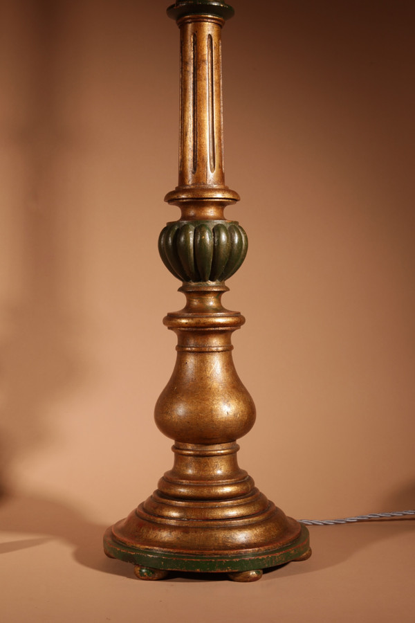 A pair of highly decorative Italian Renaissance style turned and carved giltwood floor lamps