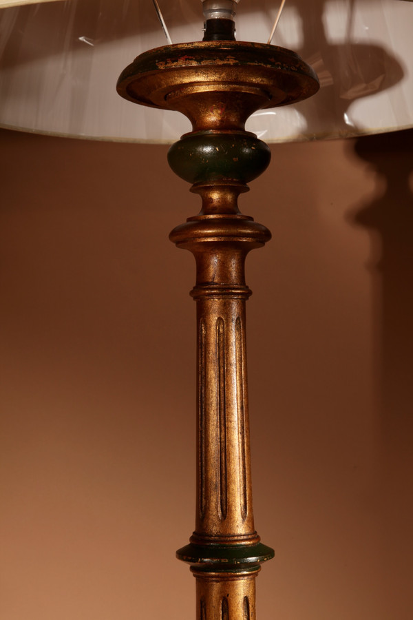 A pair of highly decorative Italian Renaissance style turned and carved giltwood floor lamps