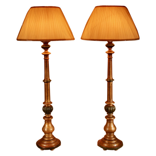 A pair of highly decorative Italian Renaissance style turned and carved giltwood floor lamps