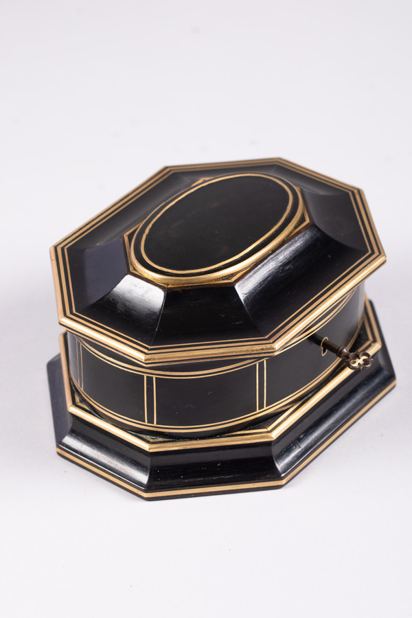 TAHAN House in Paris. Ebony and brass threaded jewelry box with cut sides
