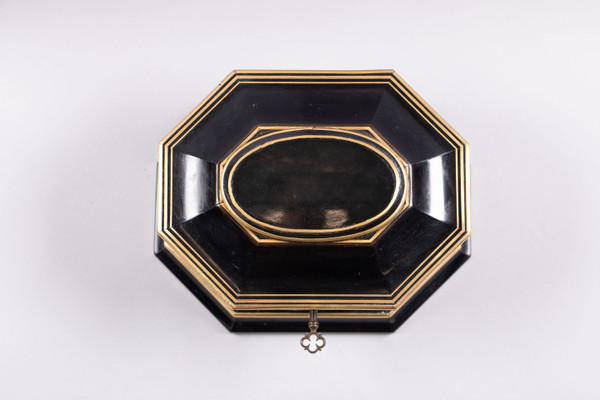 TAHAN House in Paris. Ebony and brass threaded jewelry box with cut sides