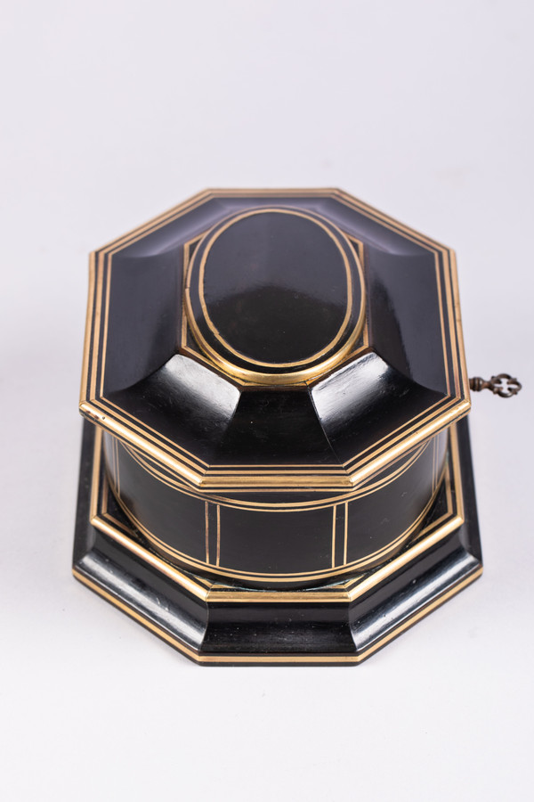 TAHAN House in Paris. Ebony and brass threaded jewelry box with cut sides
