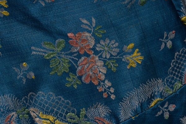 Hand-embroidered 17th or 18th century bolero jacket with floral and lace decoration