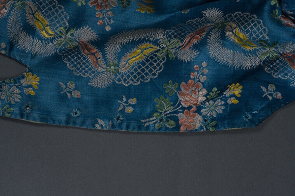 Hand-embroidered 17th or 18th century bolero jacket with floral and lace decoration