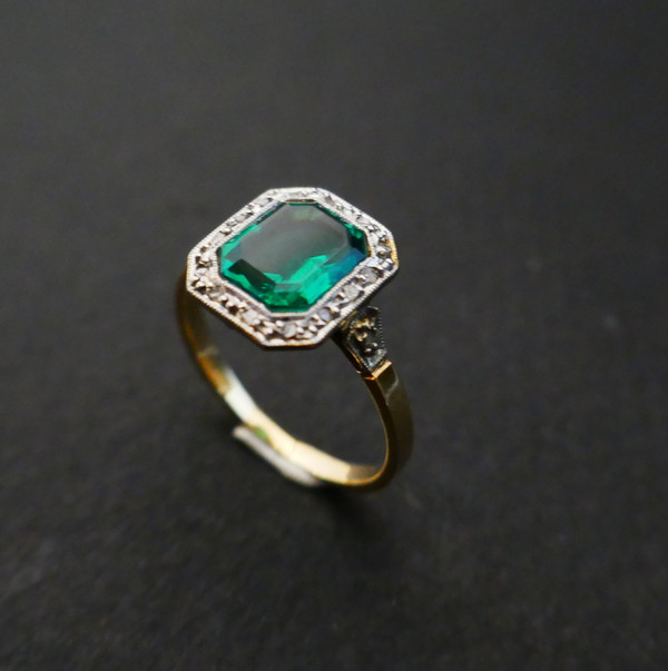 Antique ring set with an emerald and rose-cut diamonds.