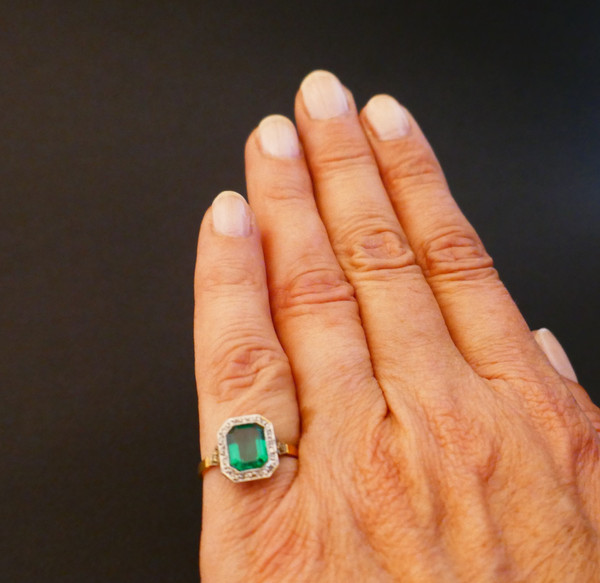 Antique ring set with an emerald and rose-cut diamonds.