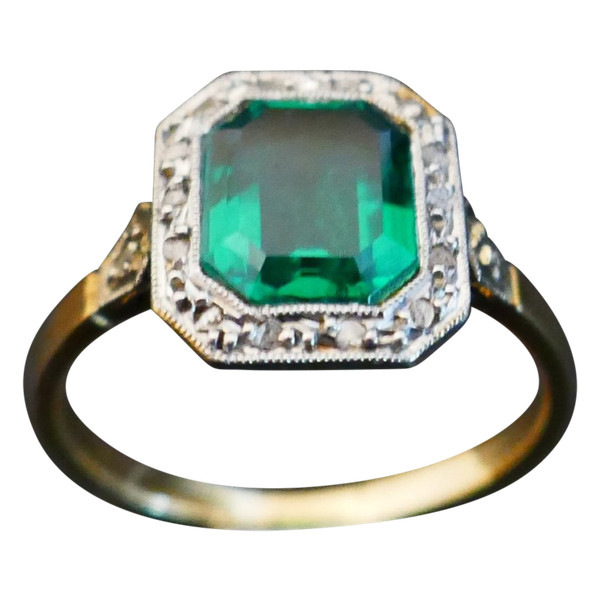 Antique ring set with an emerald and rose-cut diamonds.