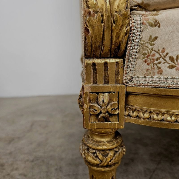 Coppia di poltrone in legno dorato in stile Luigi XVI