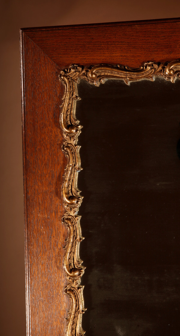 Original framed mirror in oak and gesso in the rococo style.