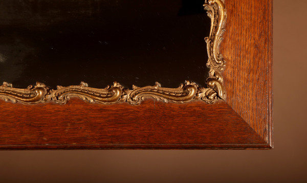Original framed mirror in oak and gesso in the rococo style.
