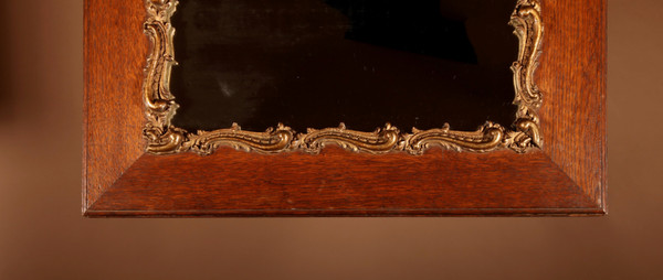 Original framed mirror in oak and gesso in the rococo style.