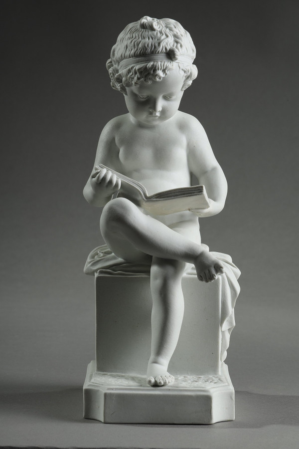 TWO SUBJECTS AT BISCUIT REPRESENTING THE CHILD READING AND THE CHILD DRAWING