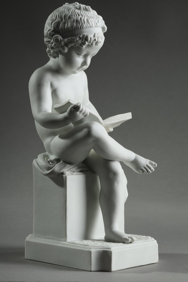 TWO SUBJECTS AT BISCUIT REPRESENTING THE CHILD READING AND THE CHILD DRAWING