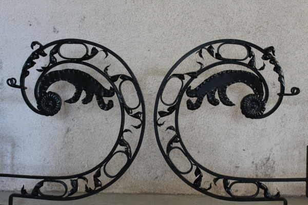Pair of large wrought iron gallows with Louis XVI style scrollwork, 20th century
