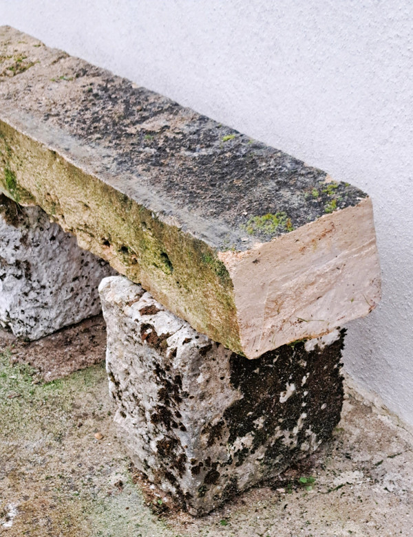 Rustic garden bench made from old stones