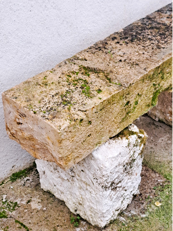 Rustic garden bench made from old stones