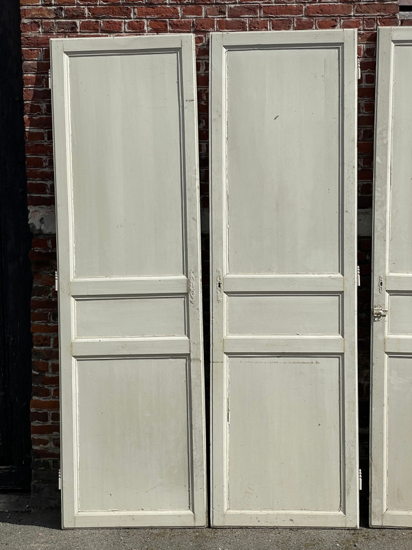 Suite of three three-panel doors