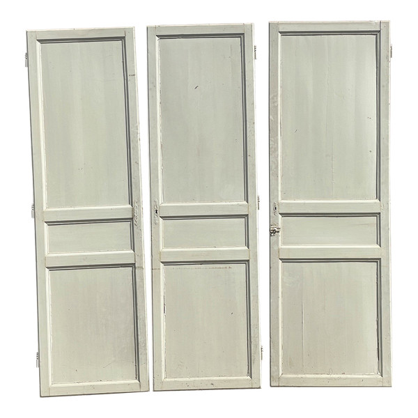 Suite of three three-panel doors