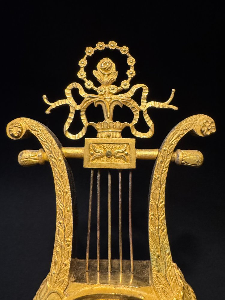 Empire period ormolu Lyre clock with dolphins