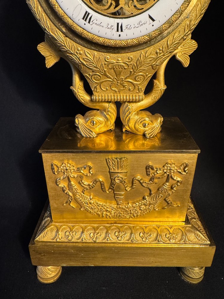 Empire period ormolu Lyre clock with dolphins