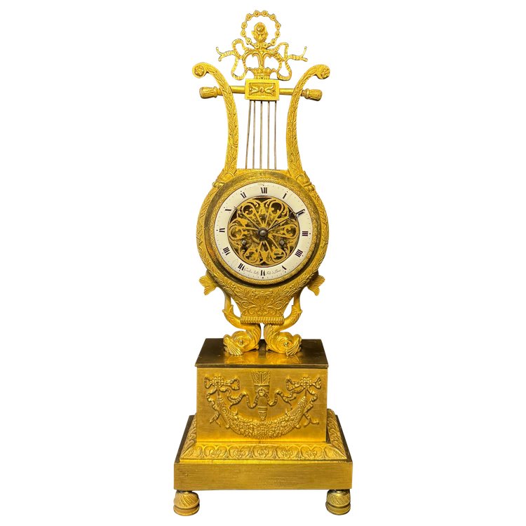 Empire period ormolu Lyre clock with dolphins