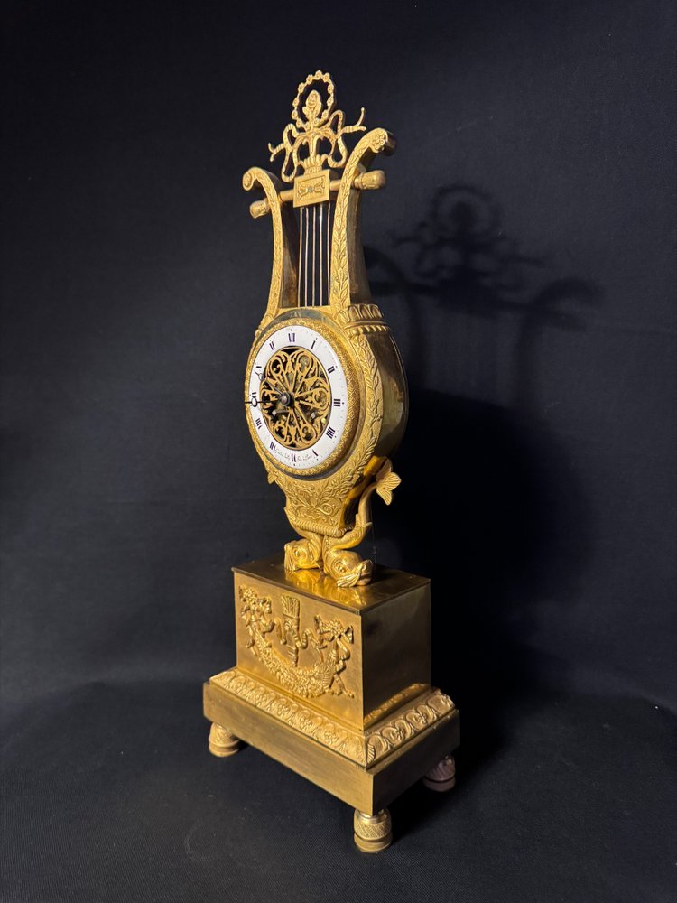Empire period ormolu Lyre clock with dolphins