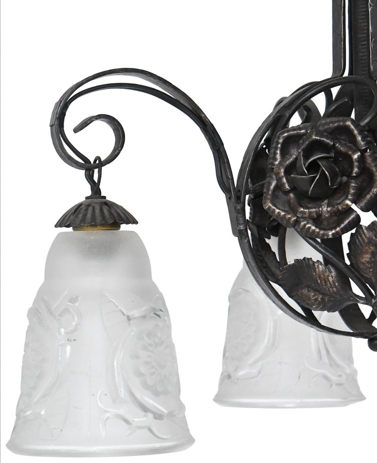 Art Deco chandelier with four molded glass tulips and wrought iron frame decorated with roses.