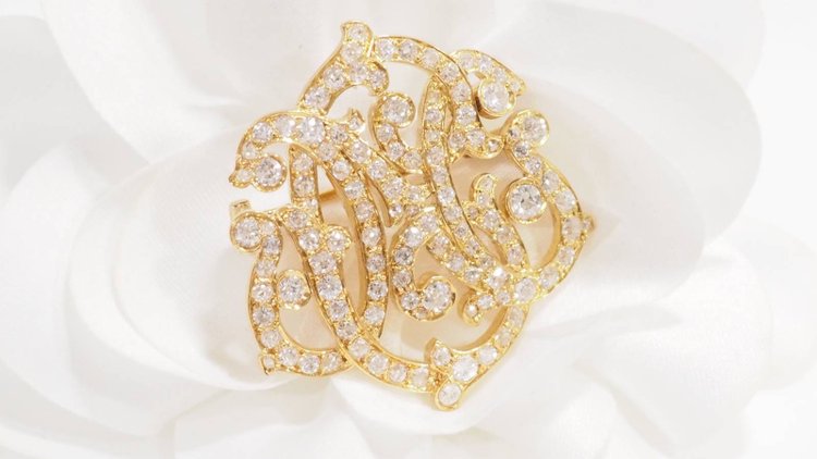 Broche volutes Art Nouveau en or jaune et diamants