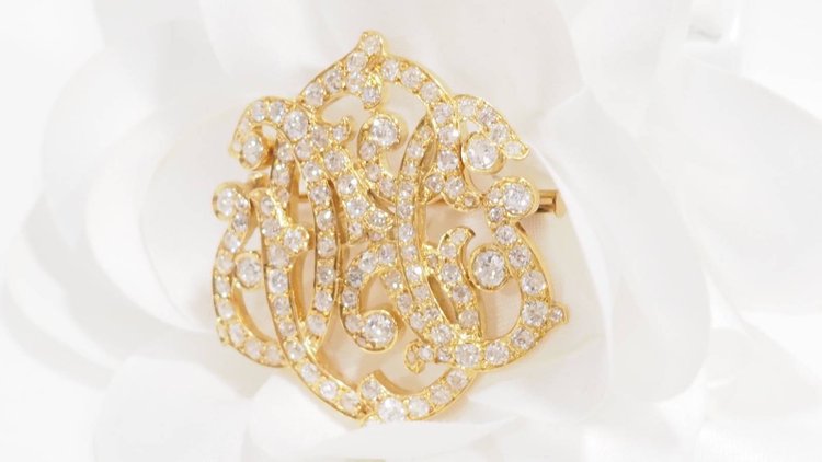 Broche volutes Art Nouveau en or jaune et diamants