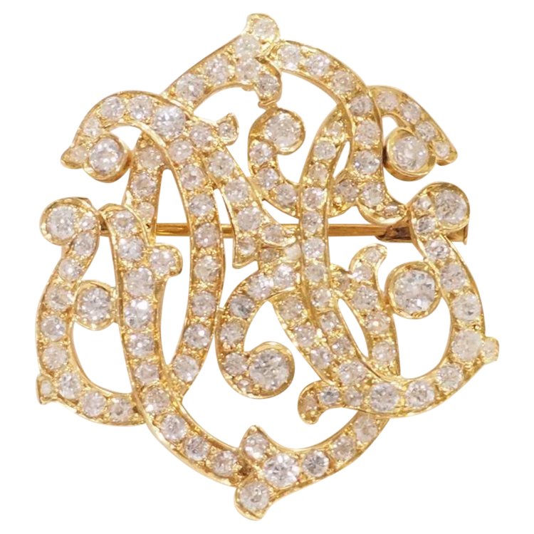 Broche volutes Art Nouveau en or jaune et diamants