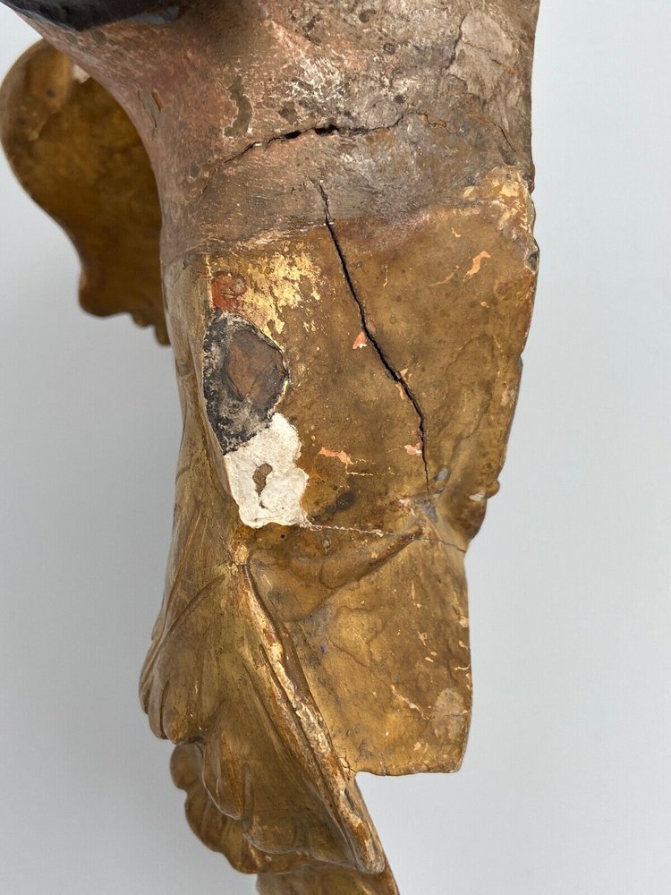 Head of a cherub in carved polychrome gilded wood, 17th century, entourage of Ignaz Günther