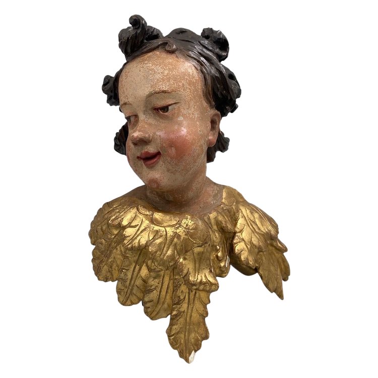 Head of a cherub in carved polychrome gilded wood, 17th century, entourage of Ignaz Günther
