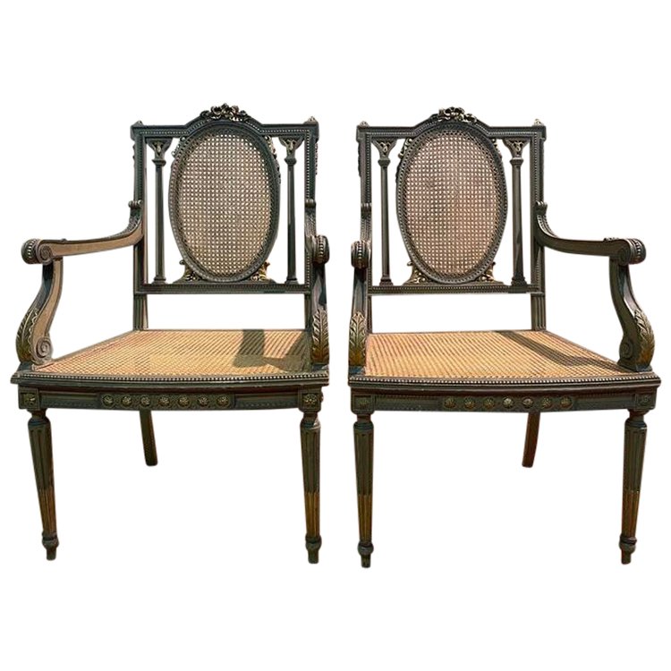 Pair of Louis XVI armchairs with re-edging and caning.